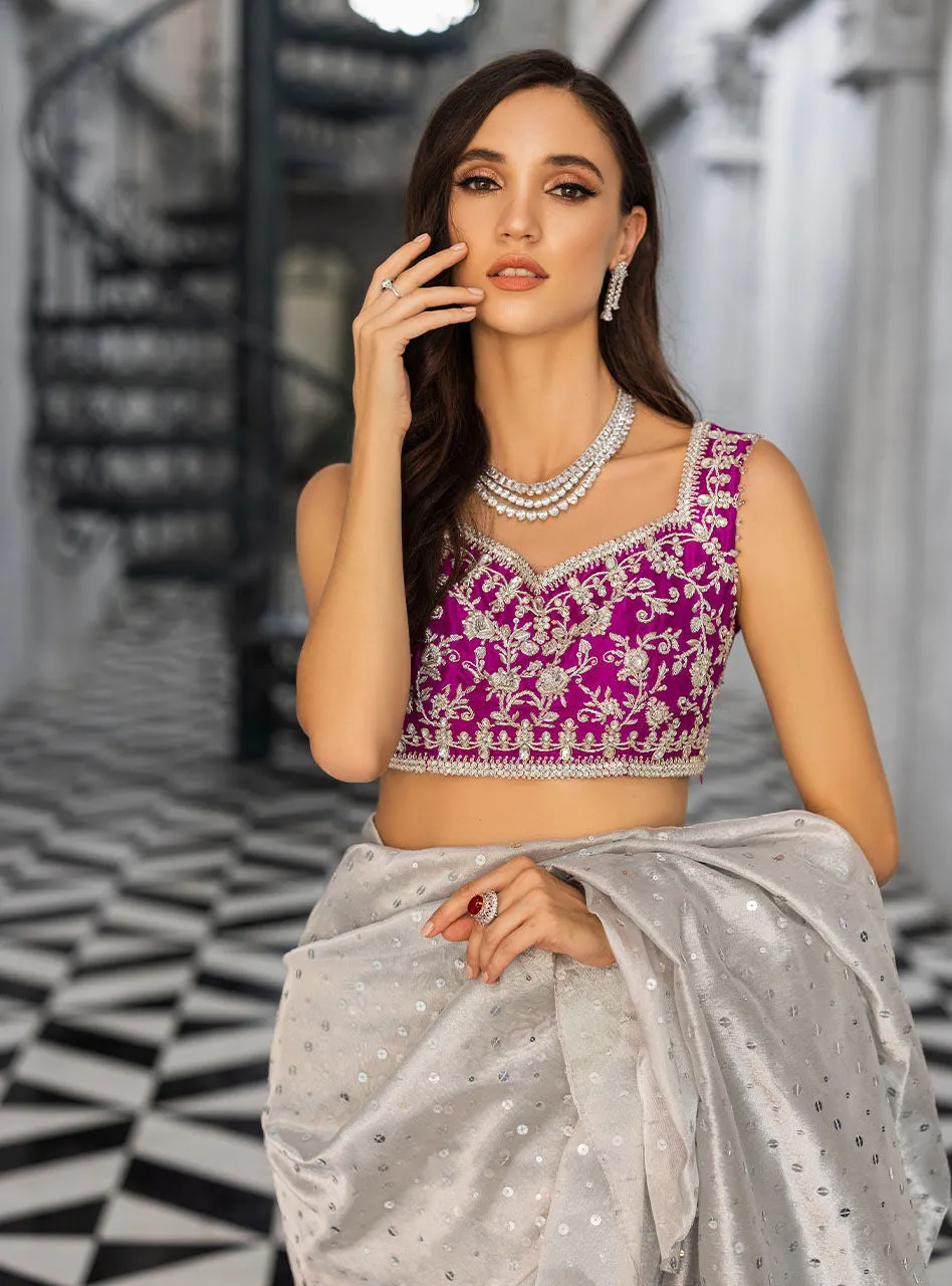 The Silver Embellished Saree in motion, showing the beautiful fluid drape of the shamose silk fabric.