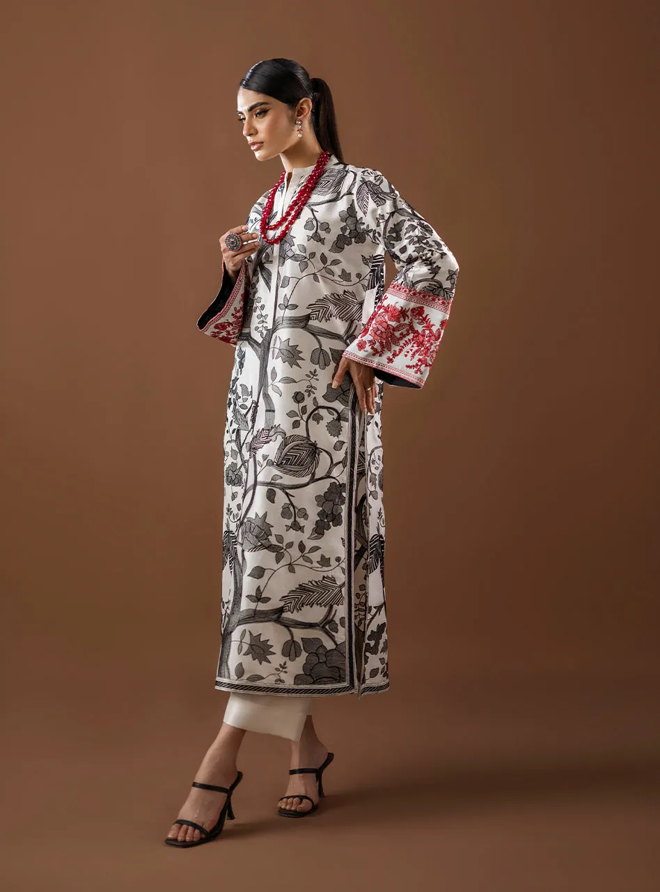 Kantha Work Shirt showcasing the full ensemble with white culottes and the bold black and red embroidery. Kantha Work Shirt showcasing the full ensemble with white culottes and the bold black and red embroidery.