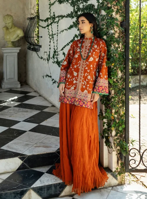 The full silhouette of the orange embroidered shirt paired with the flowing 47-inch chiffon crushed plazo pants.