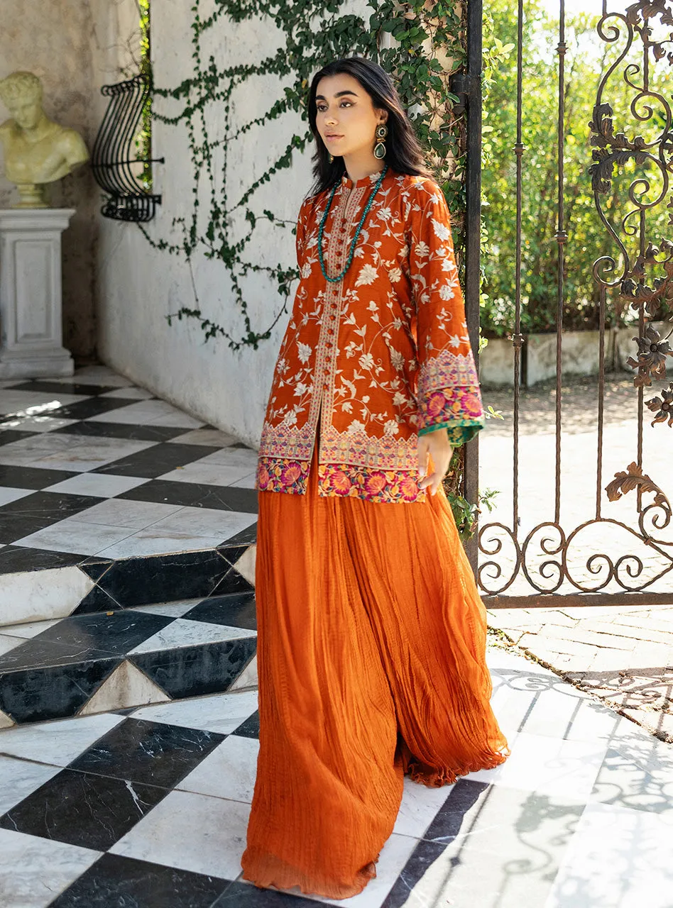Full look of the orange embroidered shirt as a complete ensemble, including the chiffon dupatta, creating a vibrant, modern look.