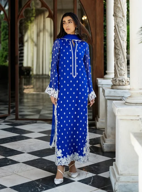 Full view of the Cobalt Blue Embroidered Suit with its luxurious viscose pants, capturing its elegant drape. Full view of the Cobalt Blue Embroidered Suit with its luxurious viscose pants, capturing its elegant drape.