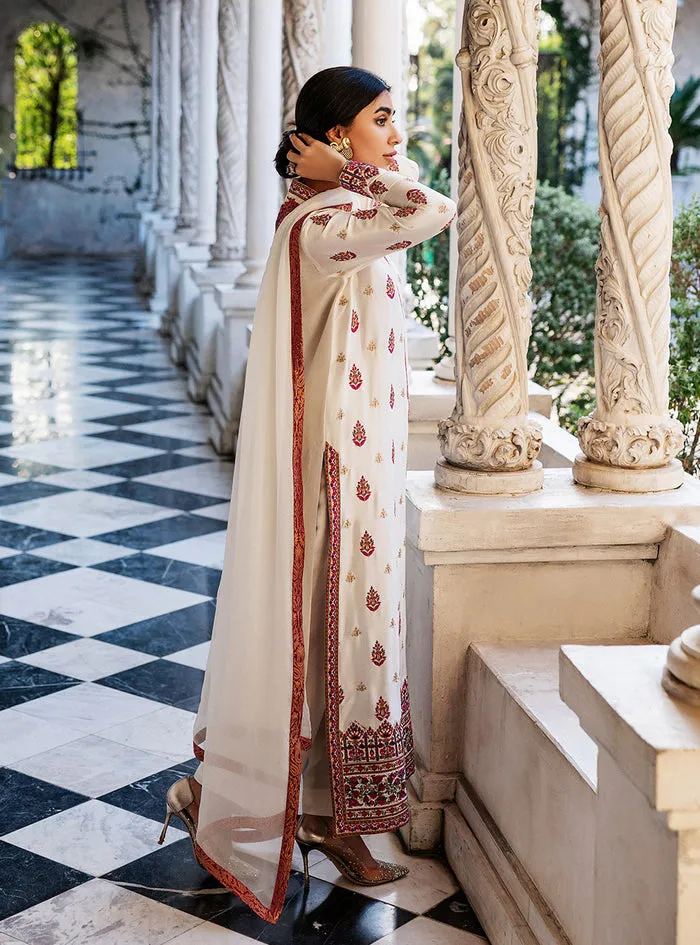 White Orchid Kashmiri Suit showcasing the luxurious pearl white tussle silk and vibrant all-over front embroidery.