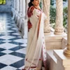 White Orchid Kashmiri Suit showcasing the luxurious pearl white tussle silk and vibrant all-over front embroidery.