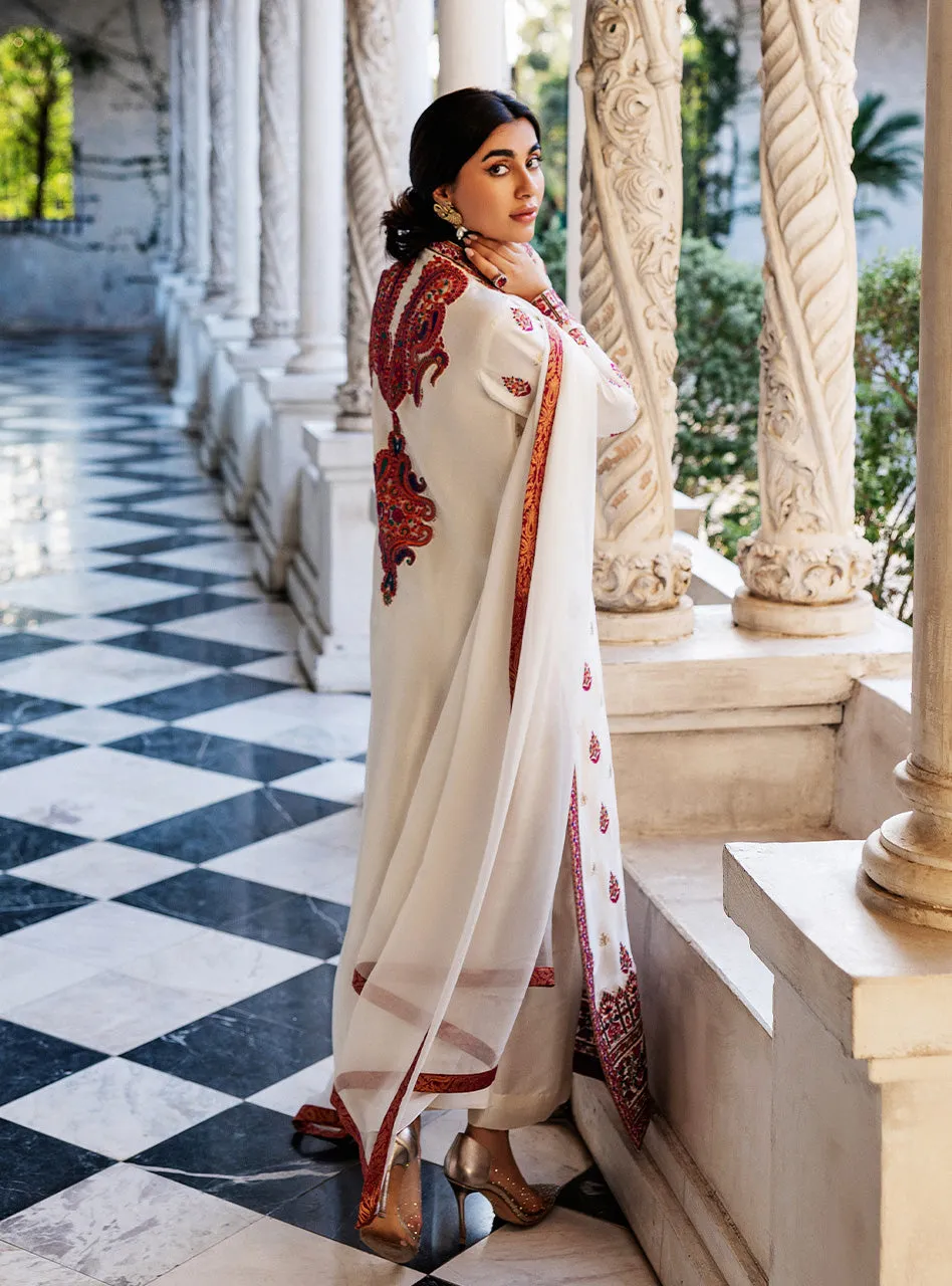 White Orchid Kashmiri Suit showcasing the luxurious pearl white tussle silk and vibrant all-over front embroidery.