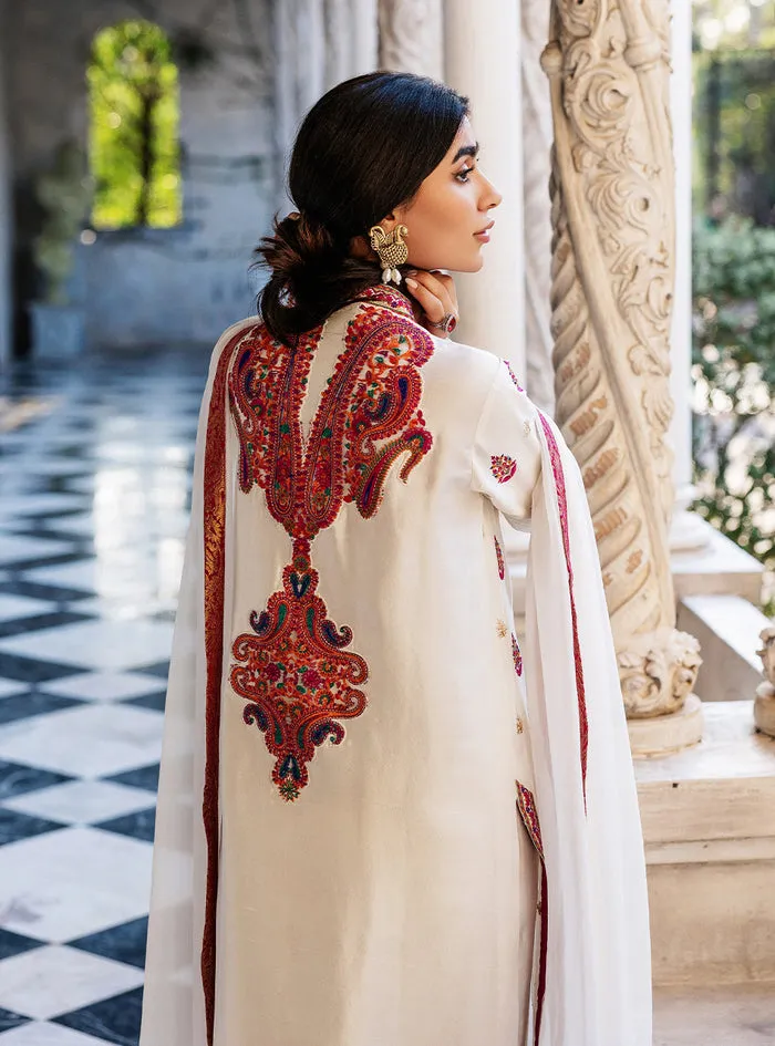 White Orchid Kashmiri Suit showcasing the luxurious pearl white tussle silk and vibrant all-over front embroidery.
