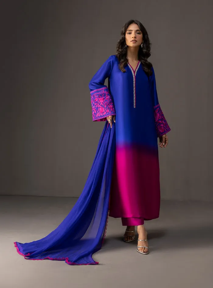 Gradient embroidered suit showing the deep blue to vibrant pink transition on luxurious tussle silk.