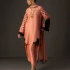 Full view of the coral embroidered suit, showcasing the contemporary silhouette and flowing chiffon dupatta.