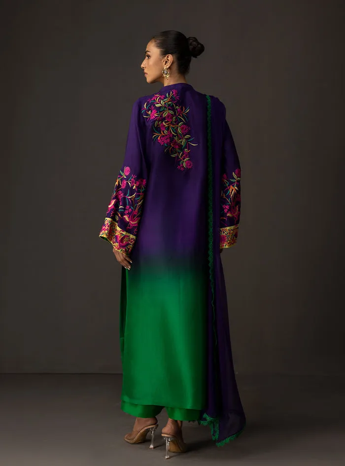 Gradient embroidered suit showcasing the majestic deep amethyst to lush emerald ombre on a flowing tussle silk shirt.