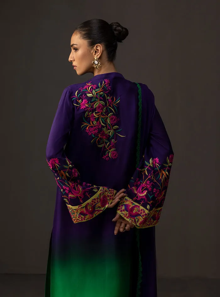 Gradient embroidered suit showcasing the majestic deep amethyst to lush emerald ombre on a flowing tussle silk shirt.