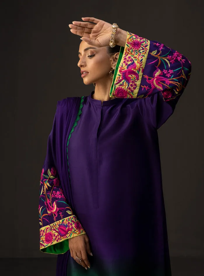 Close-up of the exquisite and colorful embroidery, a kaleidoscope of threads on the sleeve of the gradient embroidered suit.