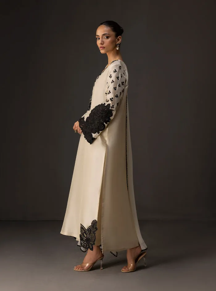 Ivory embroidered shirt showcasing the full 50-inch flowing silhouette in luxurious tussle silk.