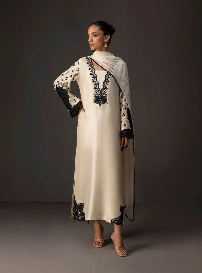 Full view of the ivory embroidered shirt as a complete suit with matching tussle silk pants and chiffon dupatta.