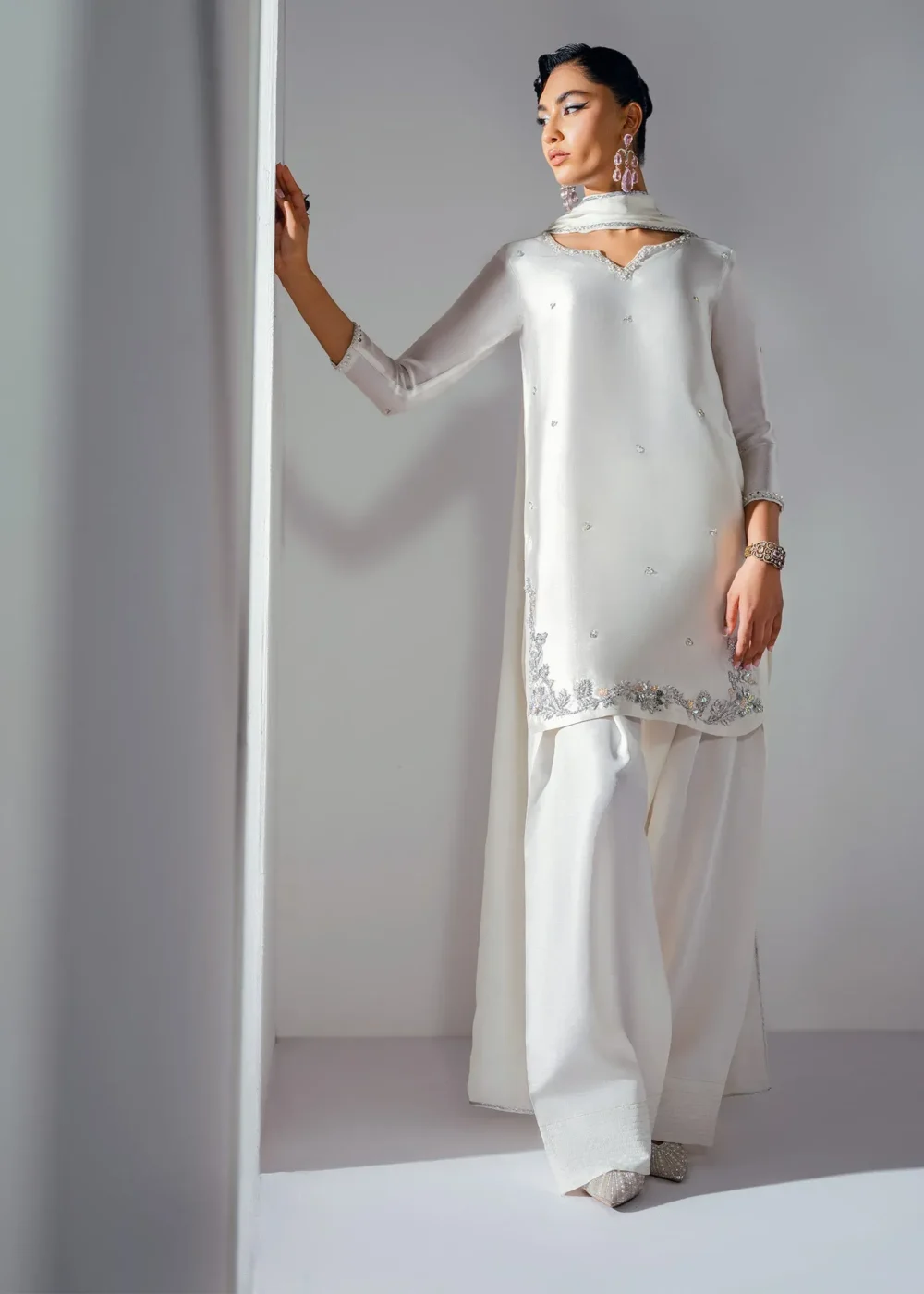 swan white Korean silk shalwar kameez swan white Korean silk shalwar kameez with 3D hand-embellished border, silver floral shalwar, and sequin silk dupatta – Hammad Impressions