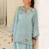 Detail of sky blue Tassel Silk kurta showing delicate embroidery and organza dupatta drape for luxury Eid wear.
