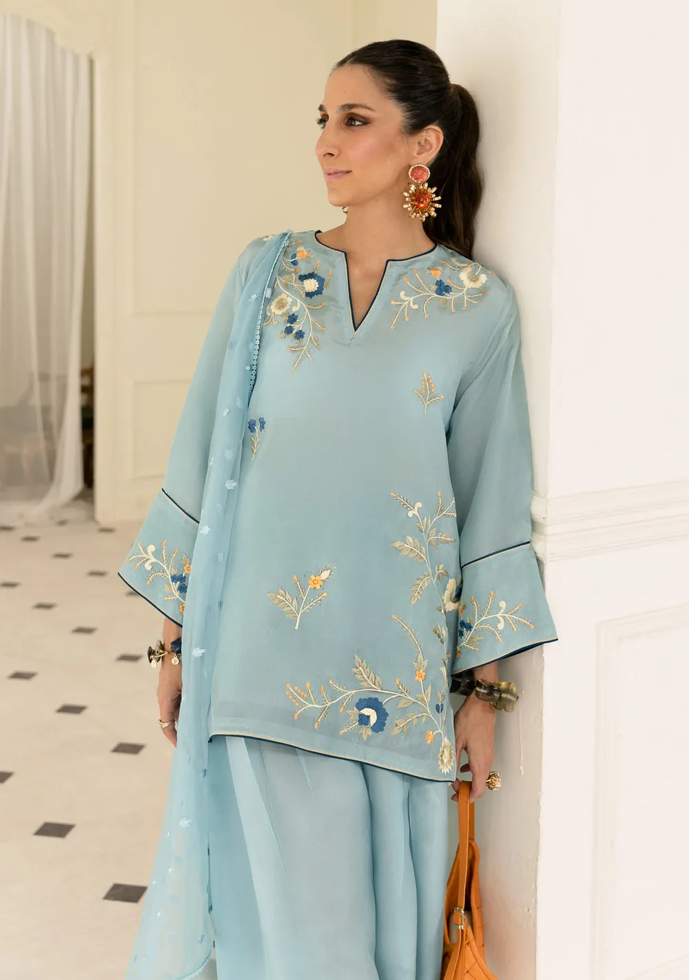 Detail of sky blue Tassel Silk kurta showing delicate embroidery and organza dupatta drape for luxury Eid wear.