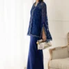 download (10) Model in royal blue organza cape and asymmetrical silk sarong skirt for a modern Eid 2026 glam look.
