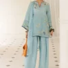Model wearing Azurea sky blue silk kurta with kharri shalwar and embroidered organza dupatta for Eid 2026 festivities.