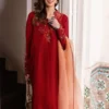 Model in brick red sheesha silk kurta and contrasting coral dupatta with asymmetrical floral embroidery for Eid.