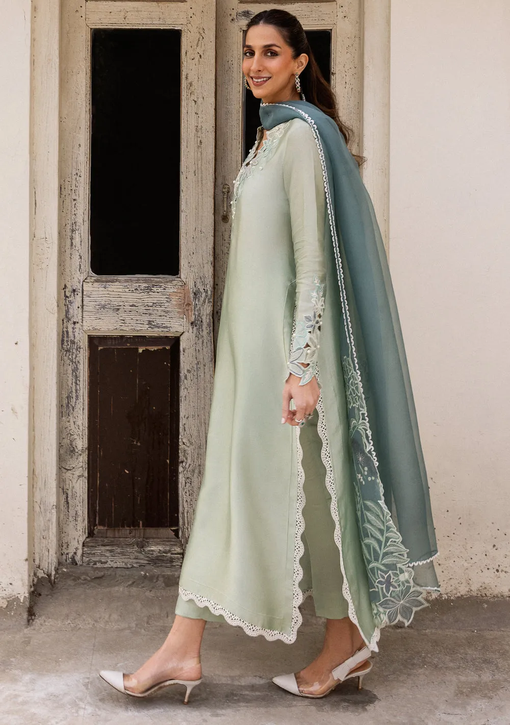 download (22) Model in aqua silk kurta paired with a contrasting deeper-blue dupatta for a refreshing Eid 2026 look.