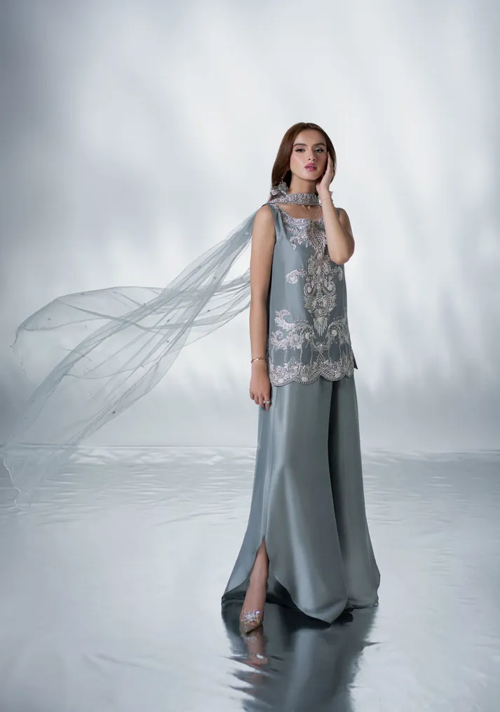 download (29) Model wearing Argenta grey raw silk shirt and elegant slit culottes with heritage craftsmanship for Eid festivities.