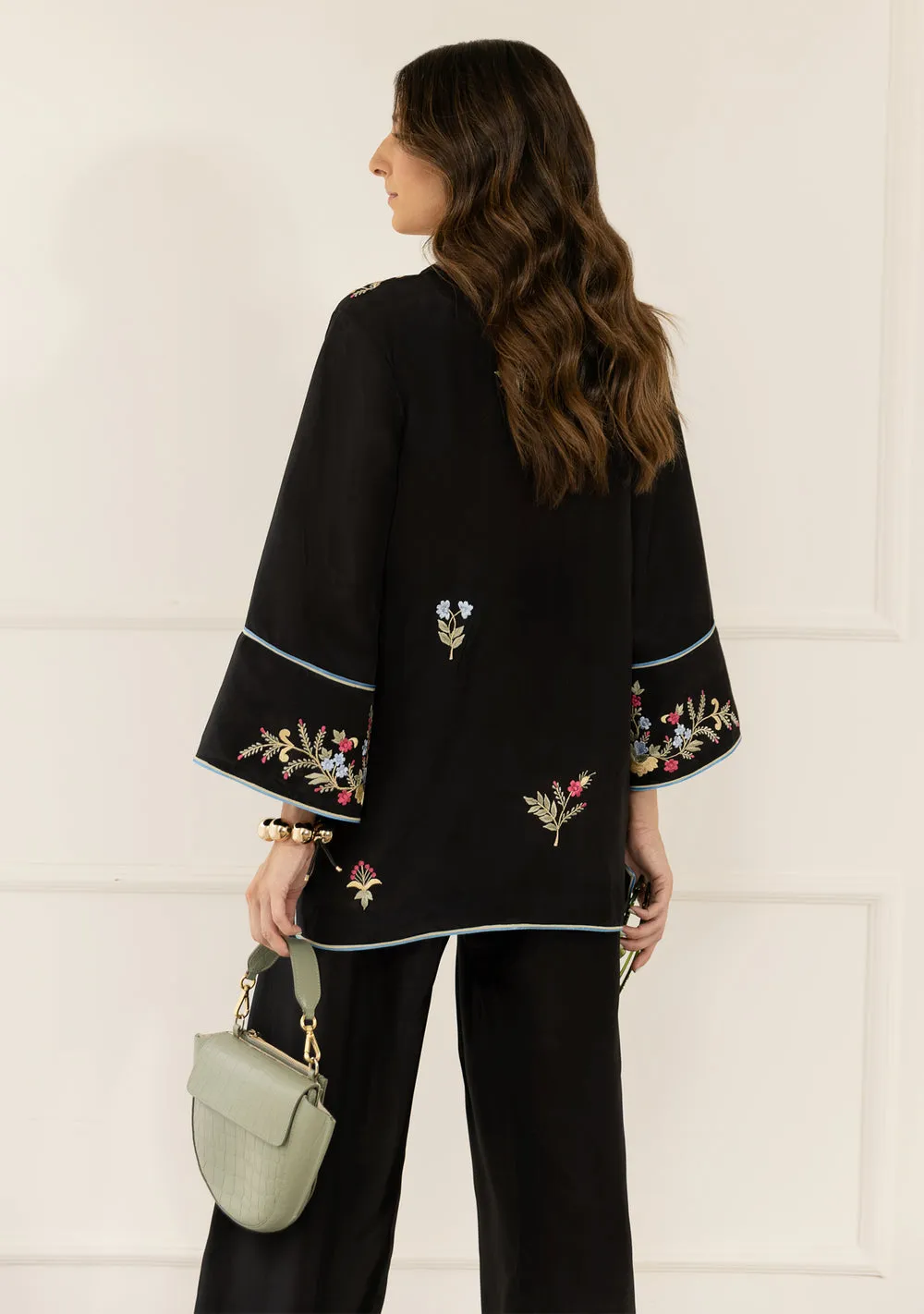 Eid Designer Black Kurta with vibrant floral embroidery and oversized sleeves by Hammad Bespoke Official for 2026.