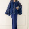 download (9) Model in royal blue organza cape and asymmetrical silk sarong skirt for a modern Eid 2026 glam look.