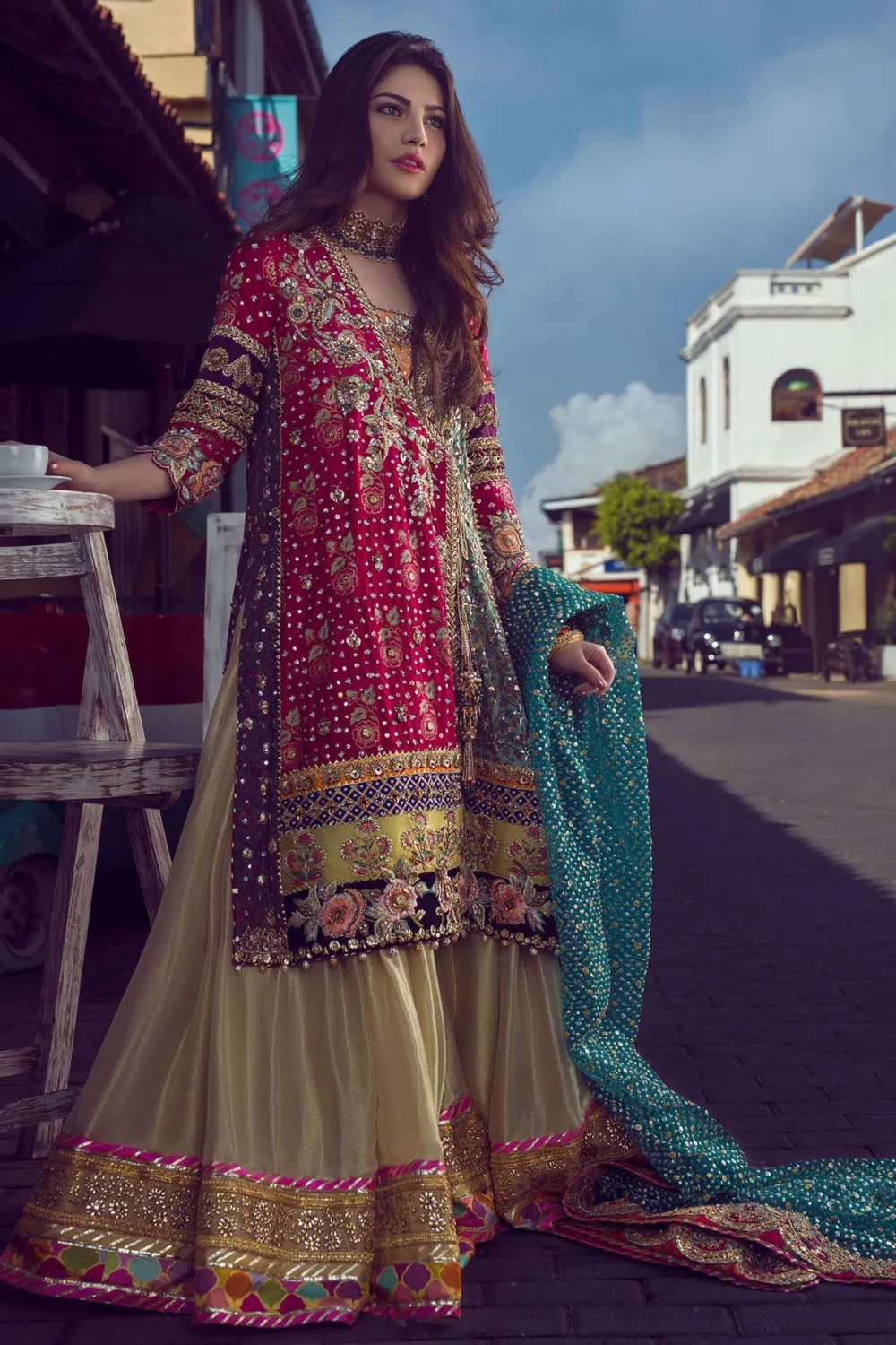 Pakistani mehndi lehenga — crimson Angharka with teal dupatta spread, Kaamdani Resham work, Hammad Bespoke Official