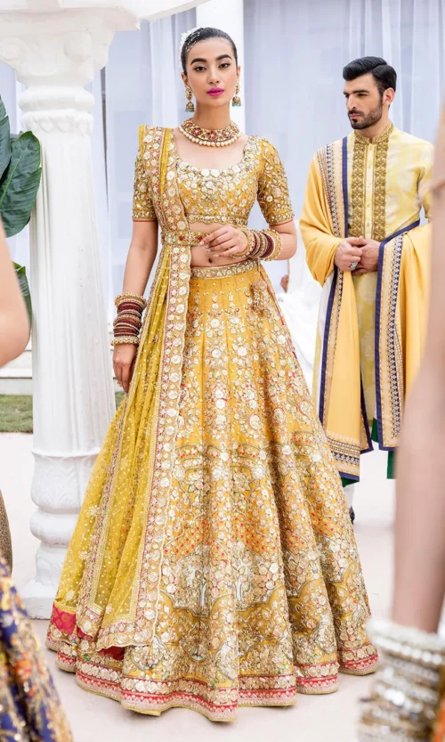 mustard-golden-lehenga-bridal-campaign-full-silhouette-gota-zardozi-hand-embroidered-hammad-bespoke-official.webp golden lehenga bridal campaign full silhouette Gota Zardozi hand embroidered Hammad Bespoke Official