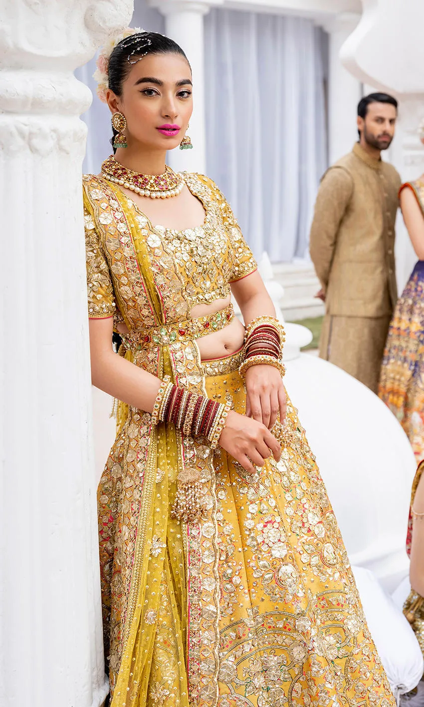 mustard-golden-lehenga-bridal-campaign-full-silhouette-gota-zardozi-hand-embroidered-hammad-bespoke-official.webp golden bridal lehenga choli close-up Zardozi floral sleeve Master Artisan embroidery Hammad Bespoke Official