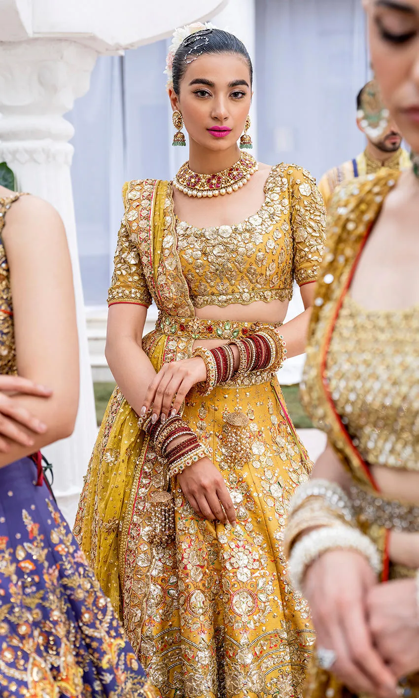 mustard-golden-lehenga-bridal-campaign-full-silhouette-gota-zardozi-hand-embroidered-hammad-bespoke-official.webp gold lehenga for bride front bodice Gota Zardozi mustard raw silk choli Hammad Bespoke Official