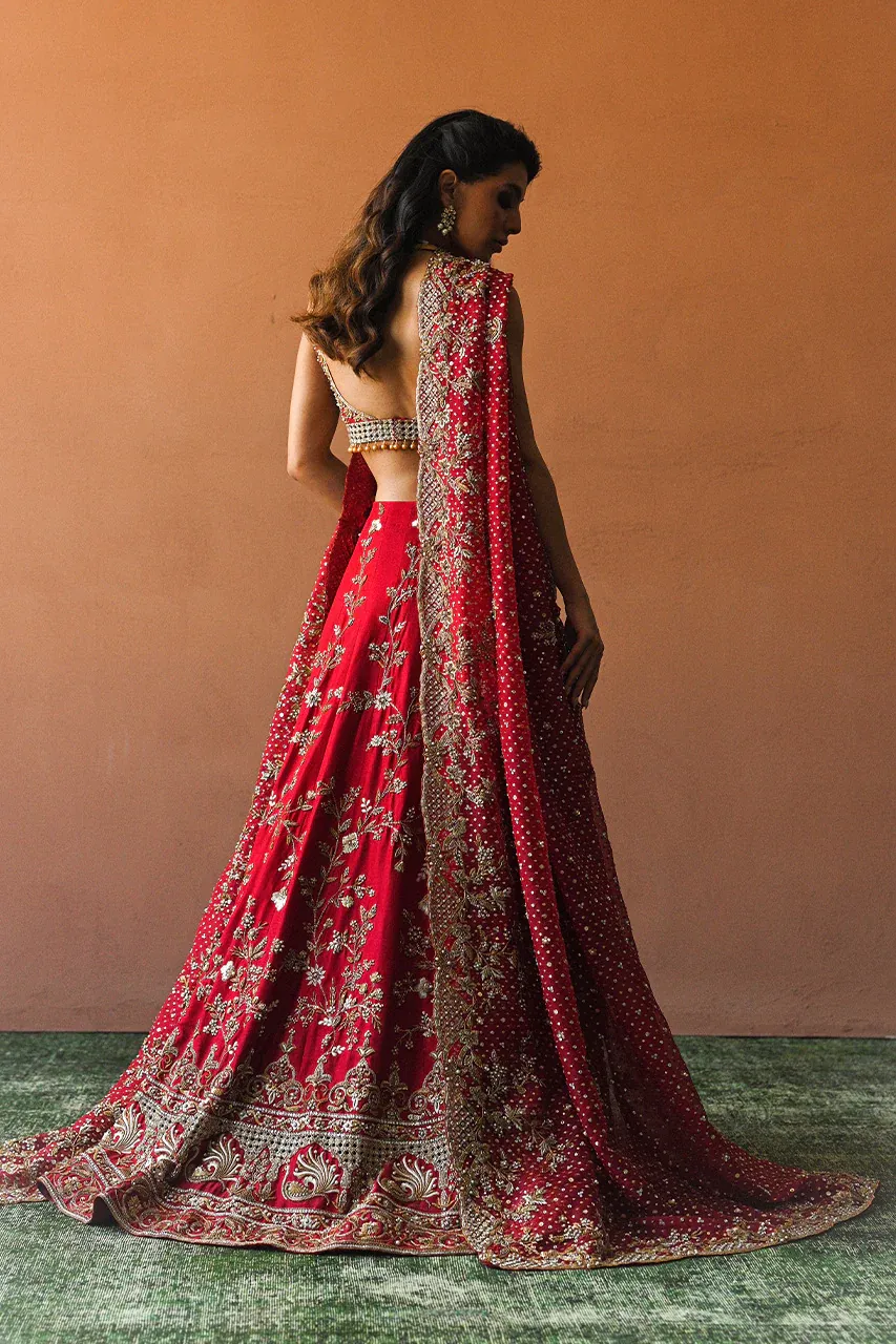 Candy red raw silk bridal lehenga back view — Zardozi floral embroidery, peacock hem, organza dupatta, Hammad Bespoke Official
