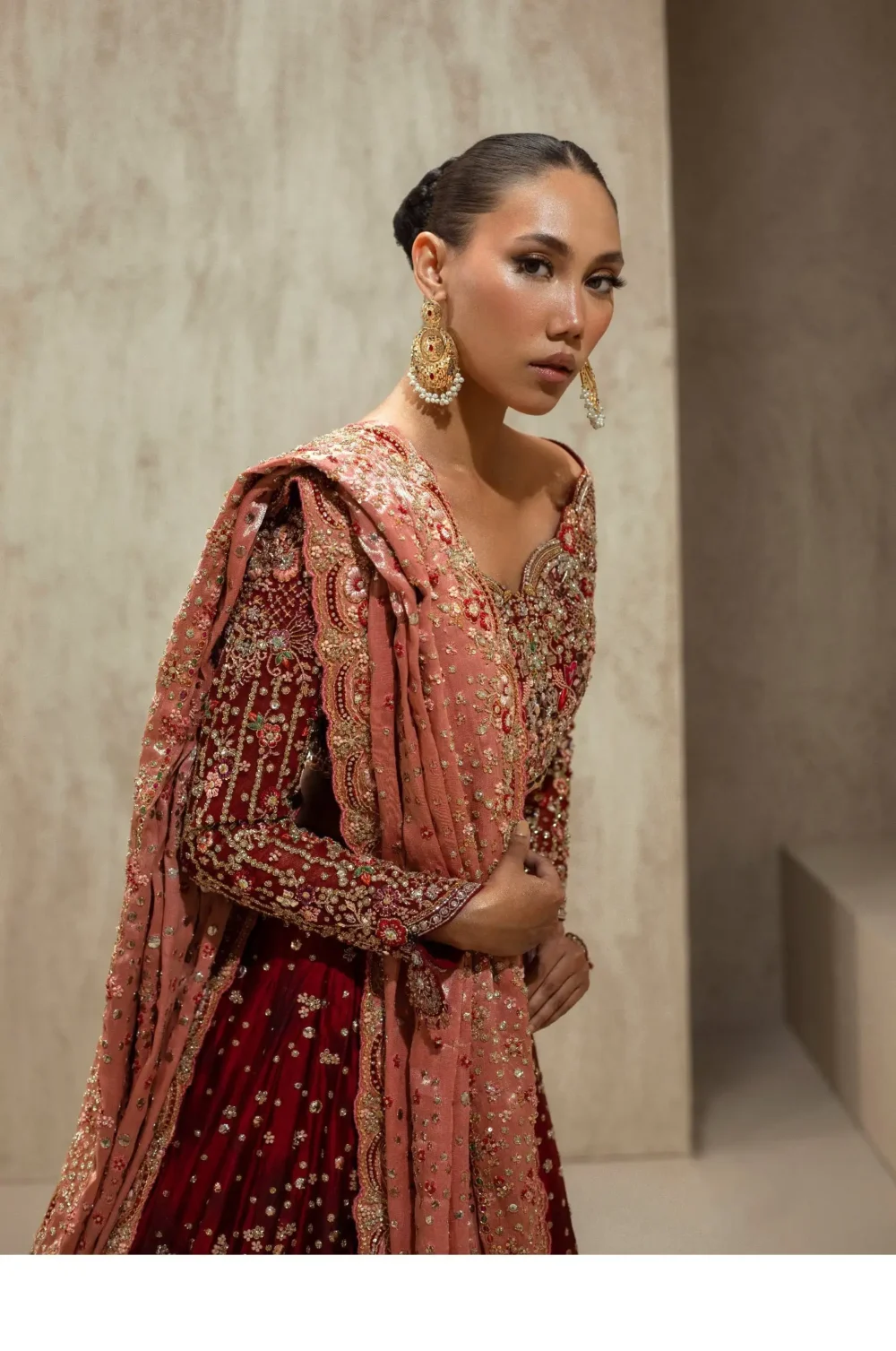 Maroon velvet bridal lehenga choli with heavy Nakshi and Resham embroidery on blush dupatta — HBO Atelier