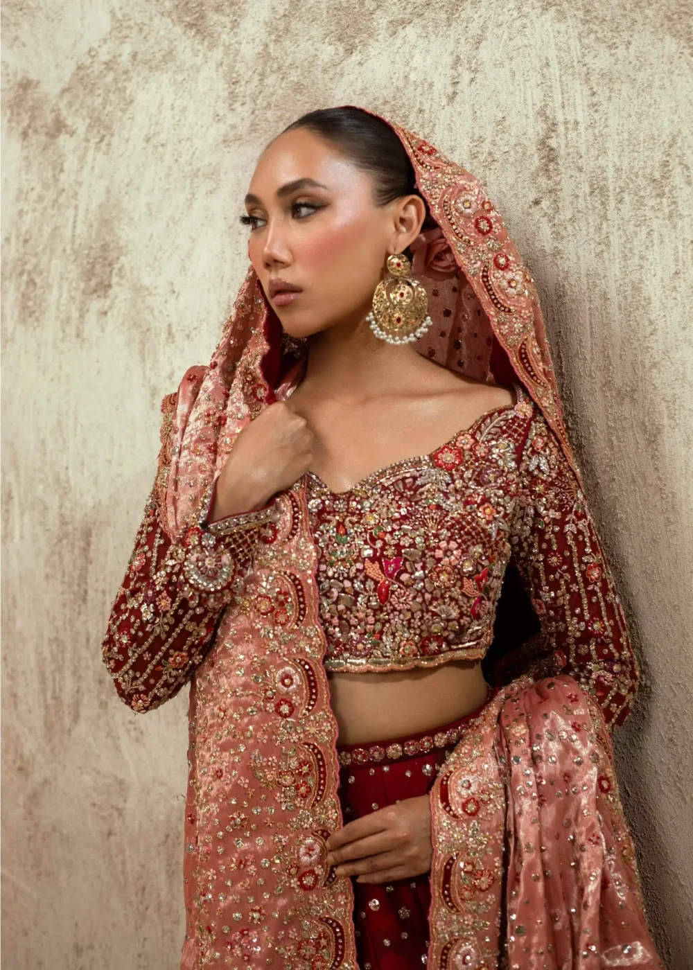 Deep-back maroon velvet bridal choli with Zardozi butterfly motif and crystal trim — Hammad Bespoke Official