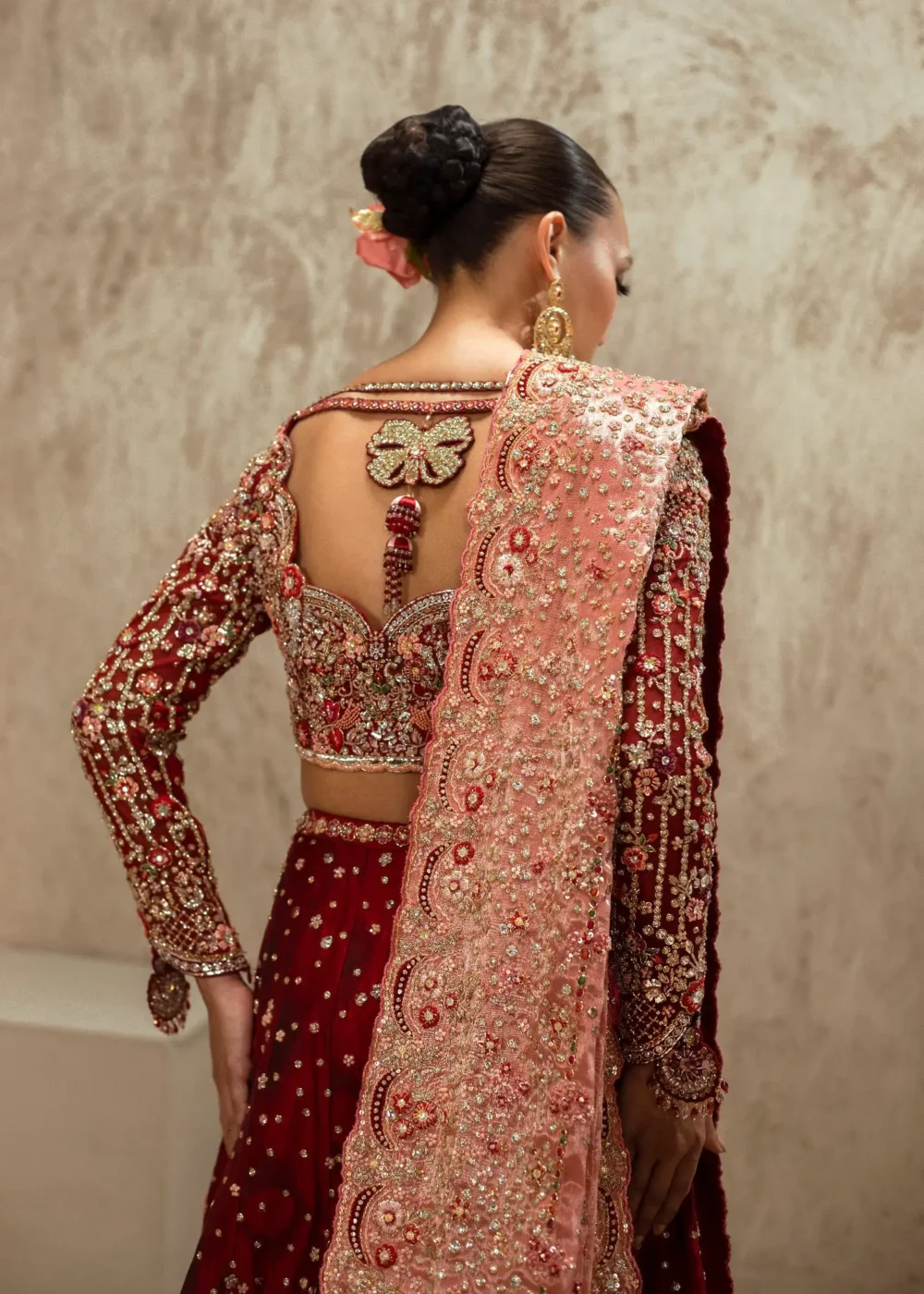 Full-length maroon velvet bridal lehenga with gold Zardozi border and cathedral train — Hammad Bespoke Official