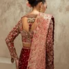 Full-length maroon velvet bridal lehenga with gold Zardozi border and cathedral train — Hammad Bespoke Official
