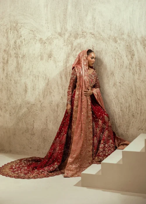 Maroon velvet bridal lehenga with blush rose dupatta and gold Zardozi train — Hammad Bespoke Official Multan Atelier
