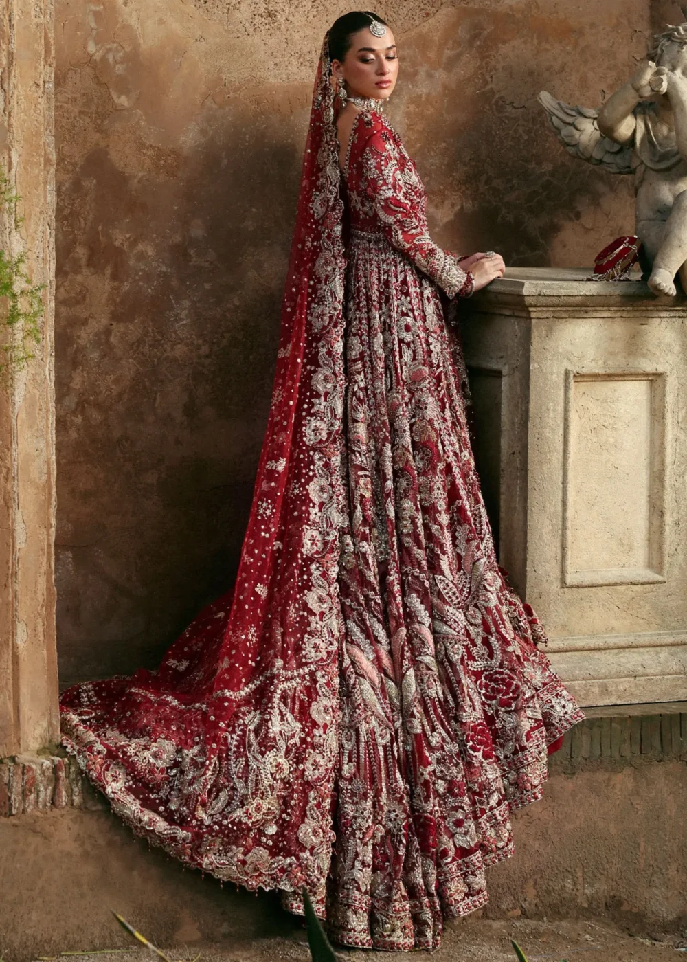 Full-length back view deep red net peshwas lehenga with embroidered dupatta train — Hammad Bespoke Official Barat bridal