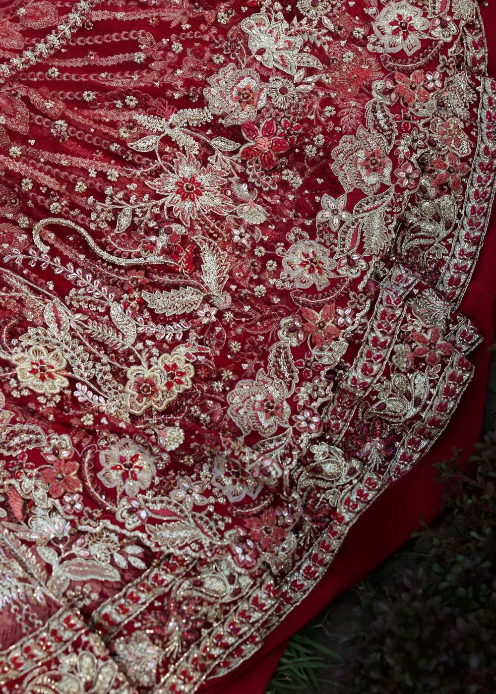 Close-up gold Zardozi and Nakshi floral embroidery on deep red net bridal lehenga — Master Artisan work, Hammad Bespoke Official