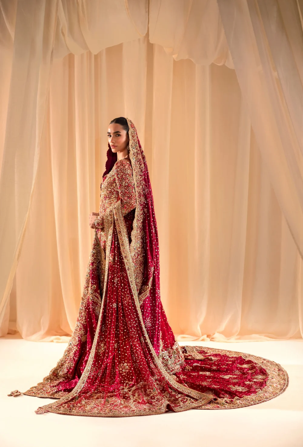 Royal red bridal lehenga Pakistani with full Zardozi train and matching embellished dupatta — Hammad Bespoke Official