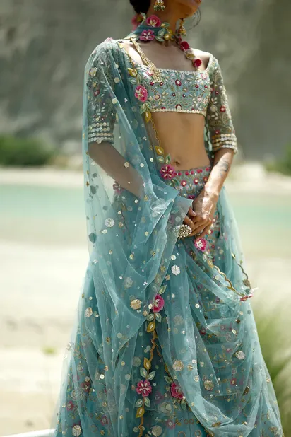 blue-lehenga-for-bride-square-neckline-choli-polychrome-florals-hammad-bespoke-official.webp blue lehenga for bride square neckline choli polychrome florals Hammad Bespoke Official