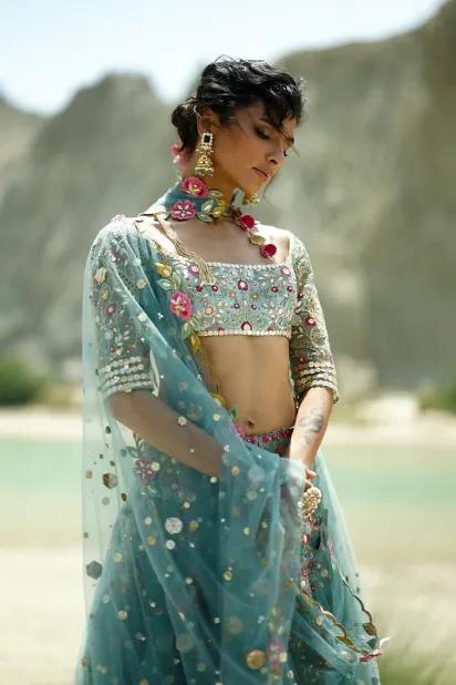 blue-lehenga-ice-tissue-zardozi-hem-dupatta-side-profile-hammad-bespoke-official.webp blue lehenga ice tissue zardozi hem dupatta side profile Hammad Bespoke Official