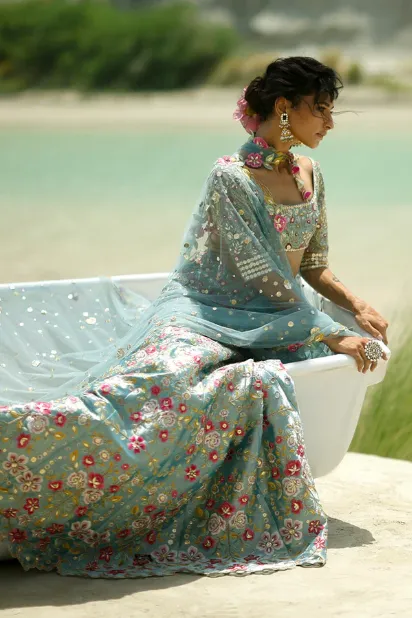 blue-lehenga-for-bride-arms-crossed-tulle-dupatta-editorial-hammad-bespoke-official.webp blue lehenga for bride arms crossed tulle dupatta editorial Hammad Bespoke Official