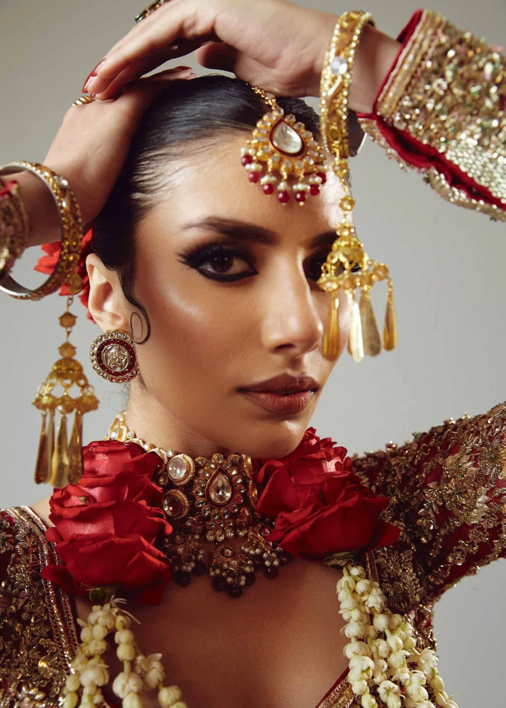 Fasanay Shahi detail shot – resham nakshi and dabka hand embroidery on red satin bridal lehenga | HBO