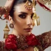Fasanay Shahi detail shot – resham nakshi and dabka hand embroidery on red satin bridal lehenga | HBO
