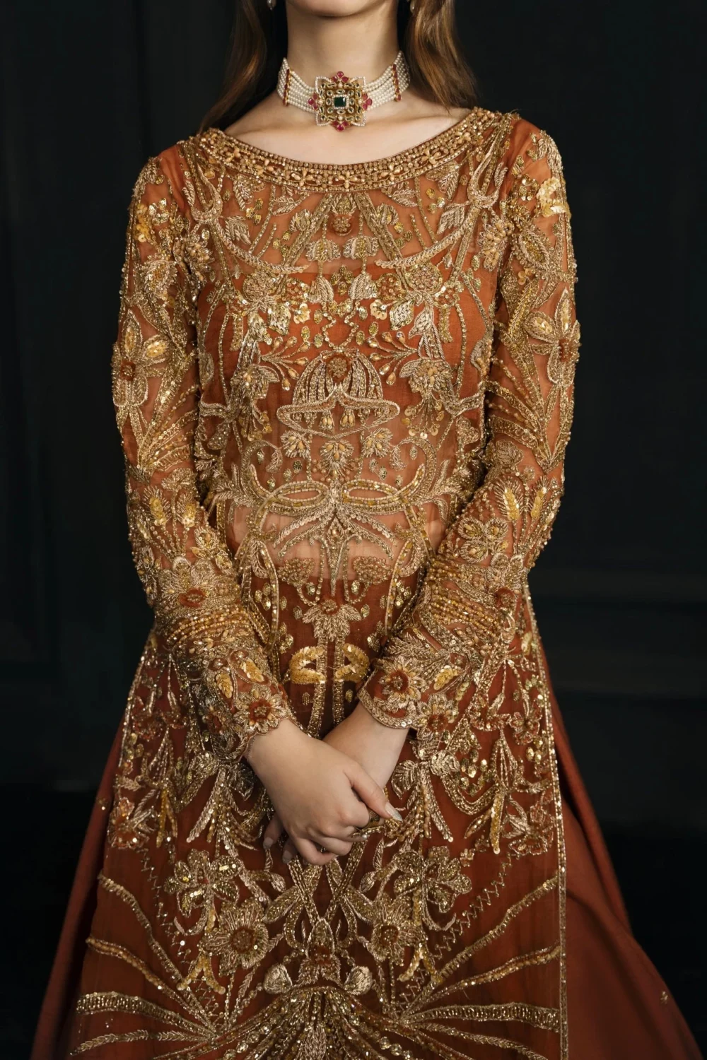 Rust orange bridal lehenga bodice — dense gold Zardozi, sequin and bead handwork by Master Artisans, Hammad Bespoke Official