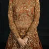 Rust orange bridal lehenga bodice — dense gold Zardozi, sequin and bead handwork by Master Artisans, Hammad Bespoke Official