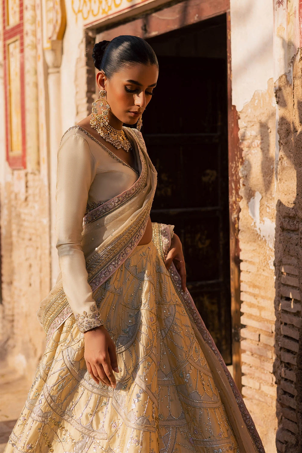 butter-yellow-lehenga-floral-resham-embroidery-choli-neckline-detail-hammad-bespoke-official.webp butter yellow lehenga floral Resham embroidery choli neckline detail Hammad Bespoke Official