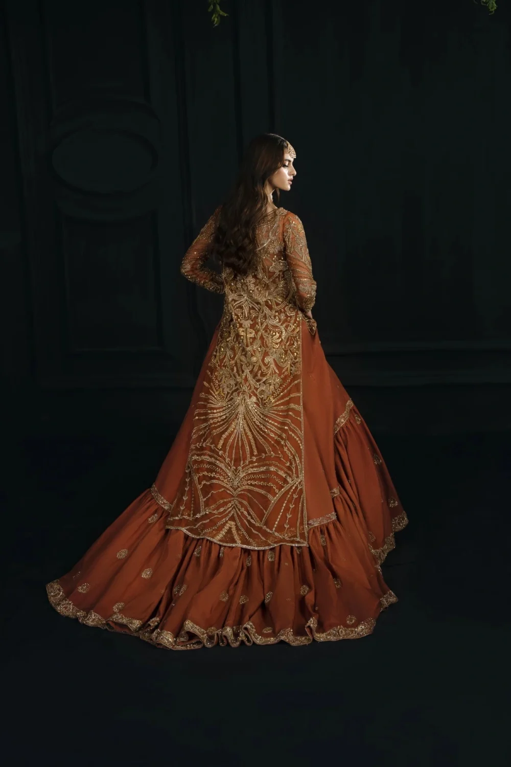 Orange bridal lehenga — rust farshi trail with antique gold Zardozi and Dabka embroidery, Hammad Bespoke Official Multan