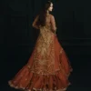 Orange bridal lehenga — rust farshi trail with antique gold Zardozi and Dabka embroidery, Hammad Bespoke Official Multan