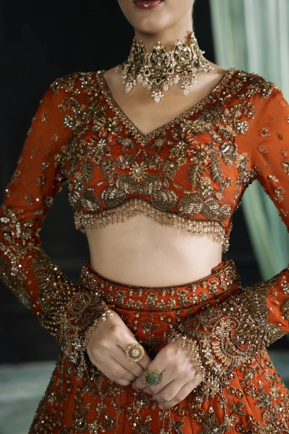 Detail shot Dabka Tilla Nakshi and 3D floral embroidery on burnt amber organza bridal lehenga choli — HBO Atelier
